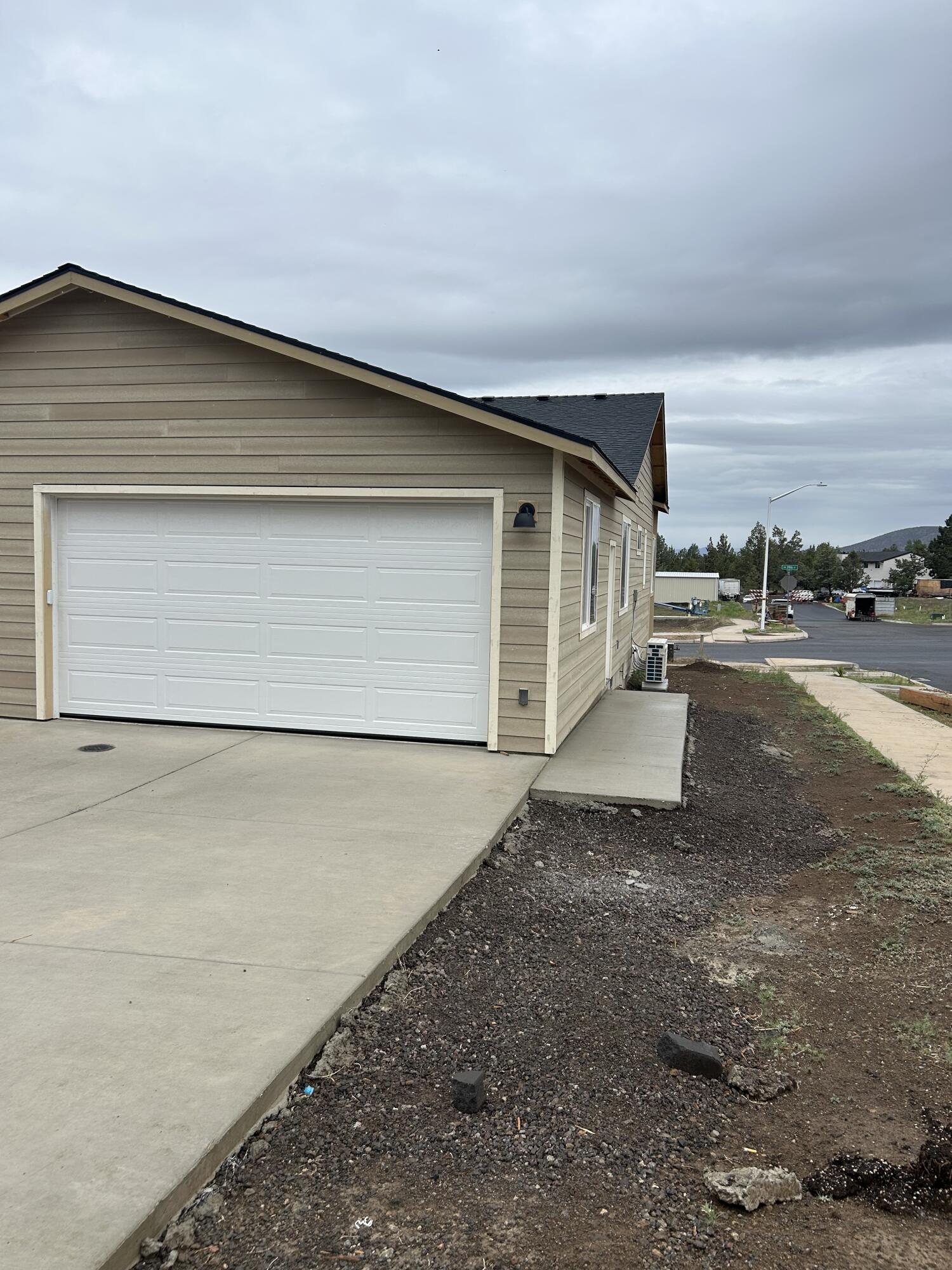 3910 Southwest 39th Street, Unit LOT 40 Redmond, OR 97756 - Photo 7 of 26 2 car garage