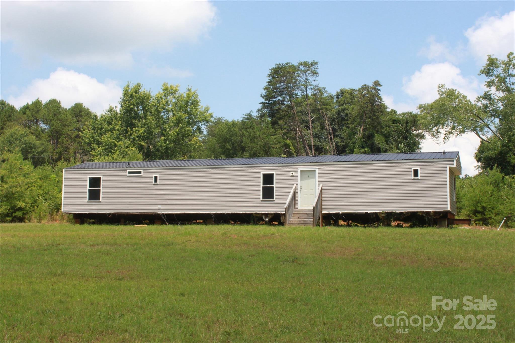 1316 Hopper Road Rutherfordton, NC 28139 - Photo 12 of 42 a balcony with table and chairs
