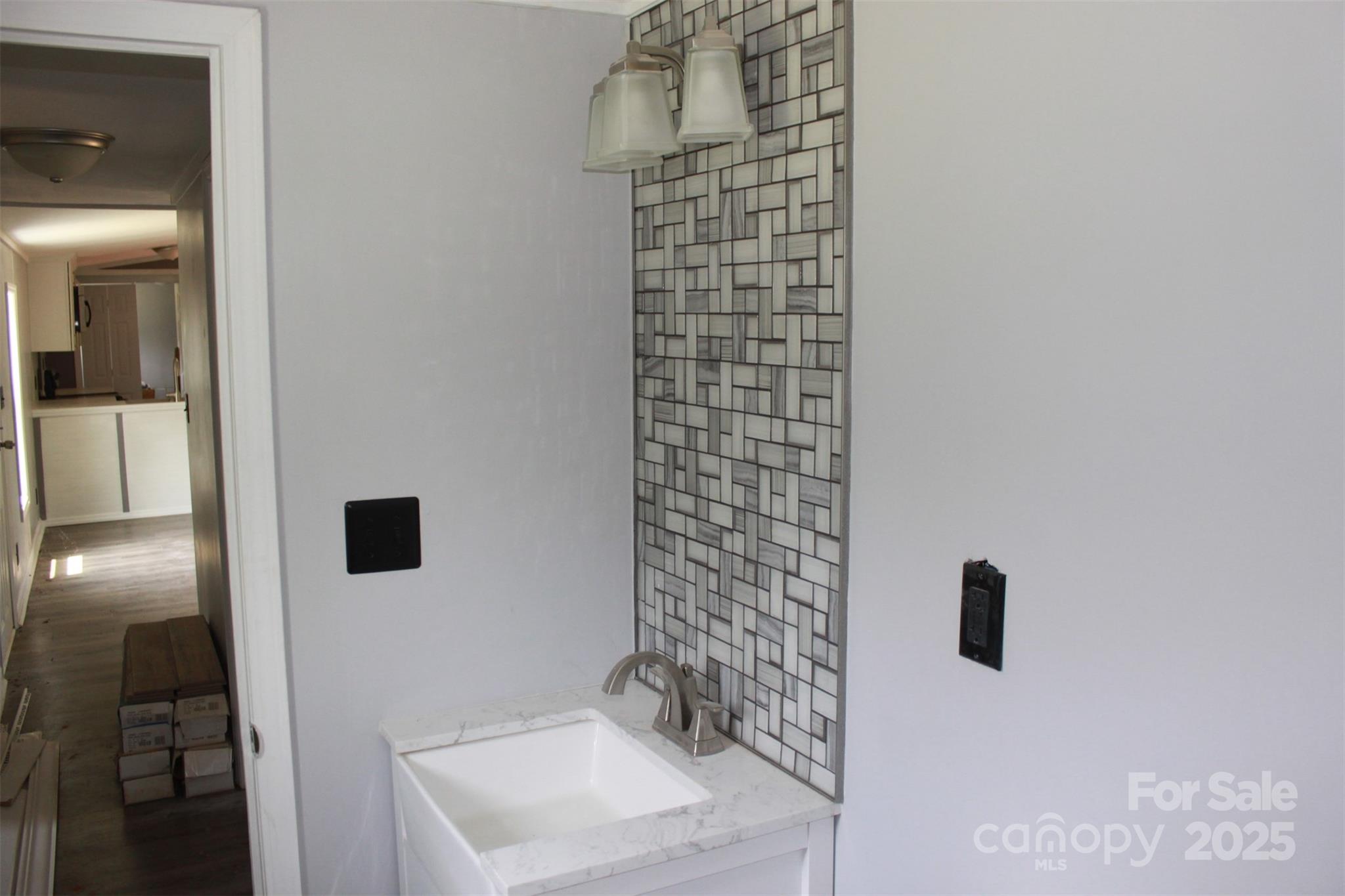 1316 Hopper Road Rutherfordton, NC 28139 - Photo 26 of 42 a bathroom with a sink and a mirror