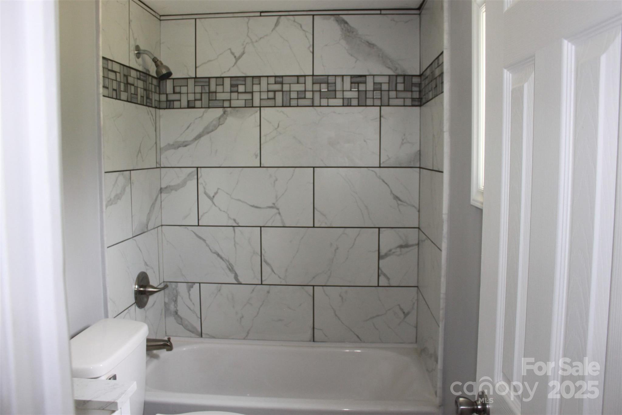 1316 Hopper Road Rutherfordton, NC 28139 - Photo 27 of 42 a bathroom with a bathtub and shower