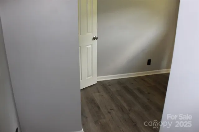 a bathroom with a wooden floor