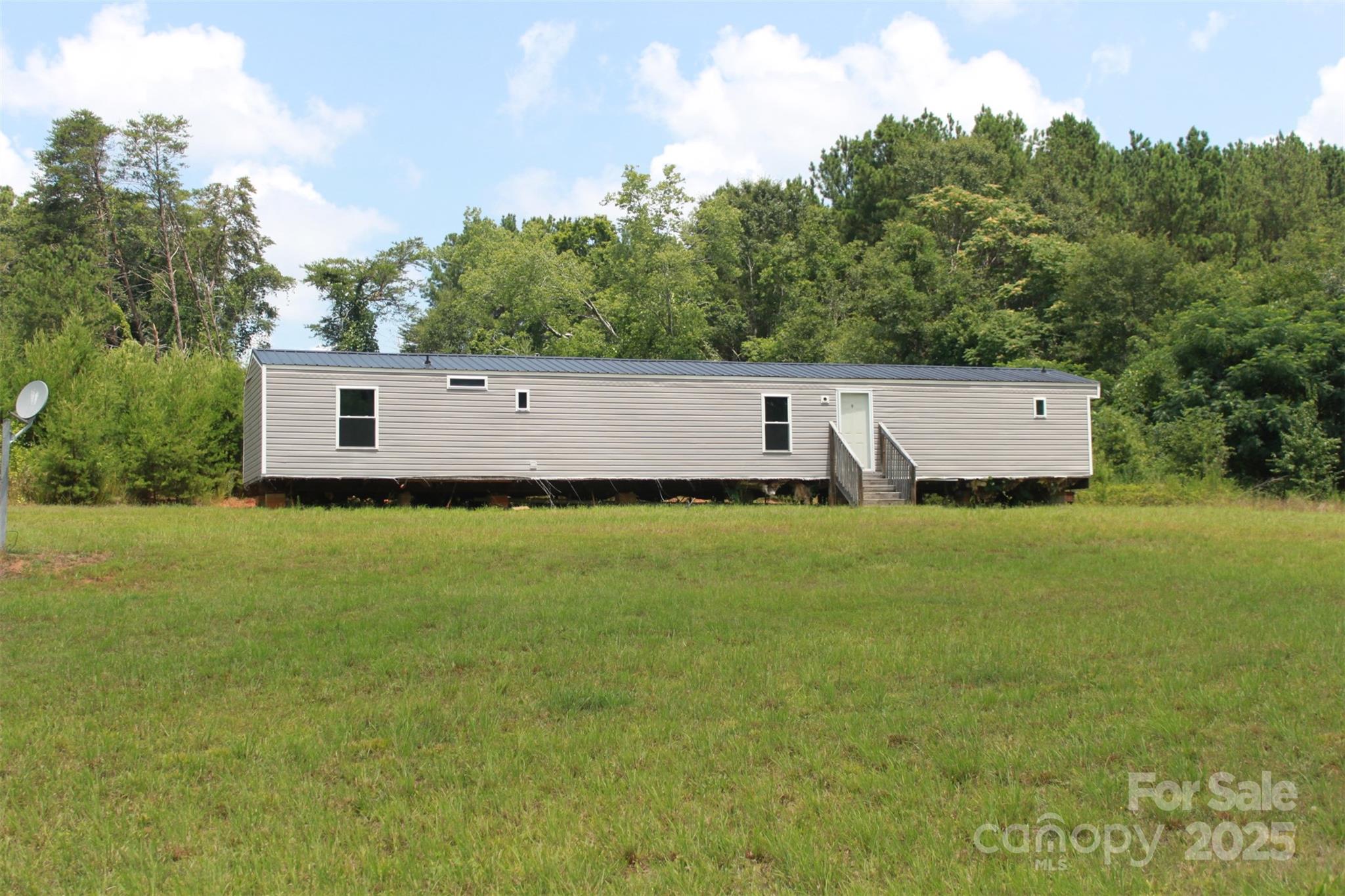 1316 Hopper Road Rutherfordton, NC 28139 - Photo 9 of 42 a view of a house with a garden