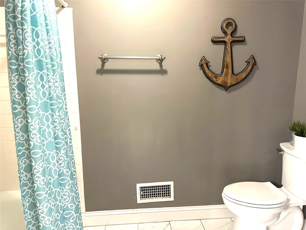 209 Keystone Drive Anderson, SC 29621 - Photo 14 of 20 This clean bathroom features practical tile flooring and a functional shower area.