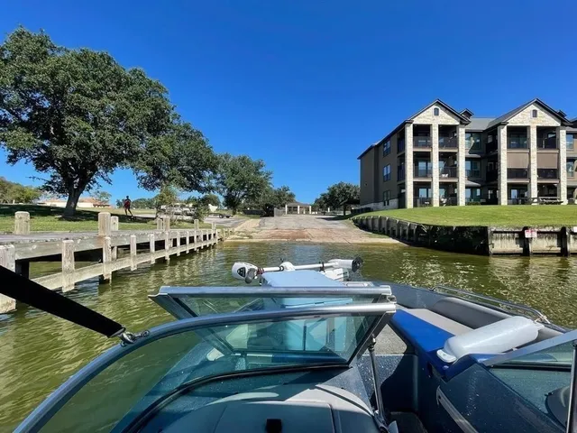 a view of a patio with furniture and a lake view