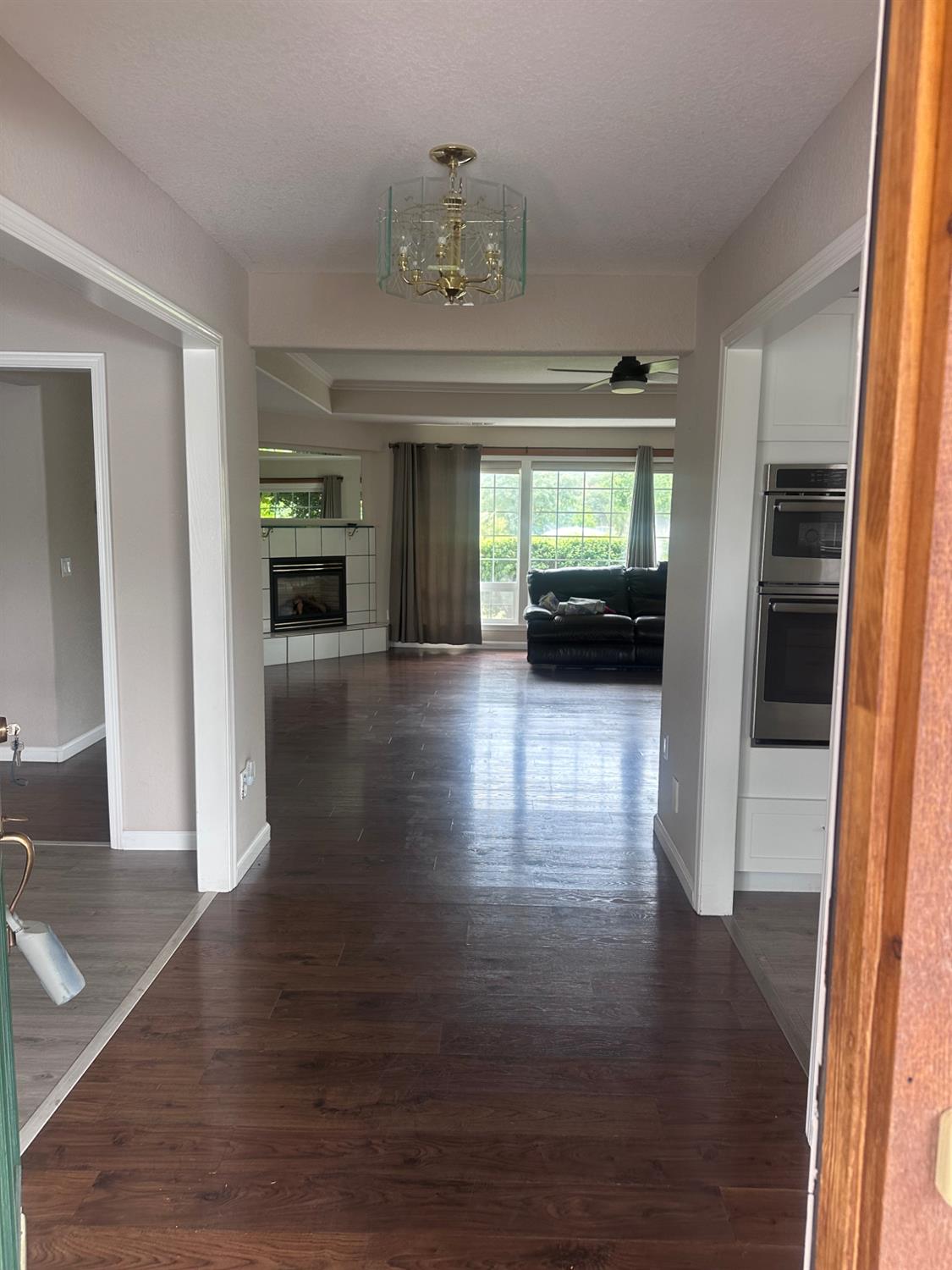 7124 Ospital Road Valley Springs, CA 95252 - Photo 31 of 37 a view of a hallway view with wooden floor and a living room