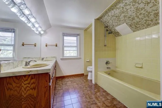 a bathroom with a sink and a bathtub