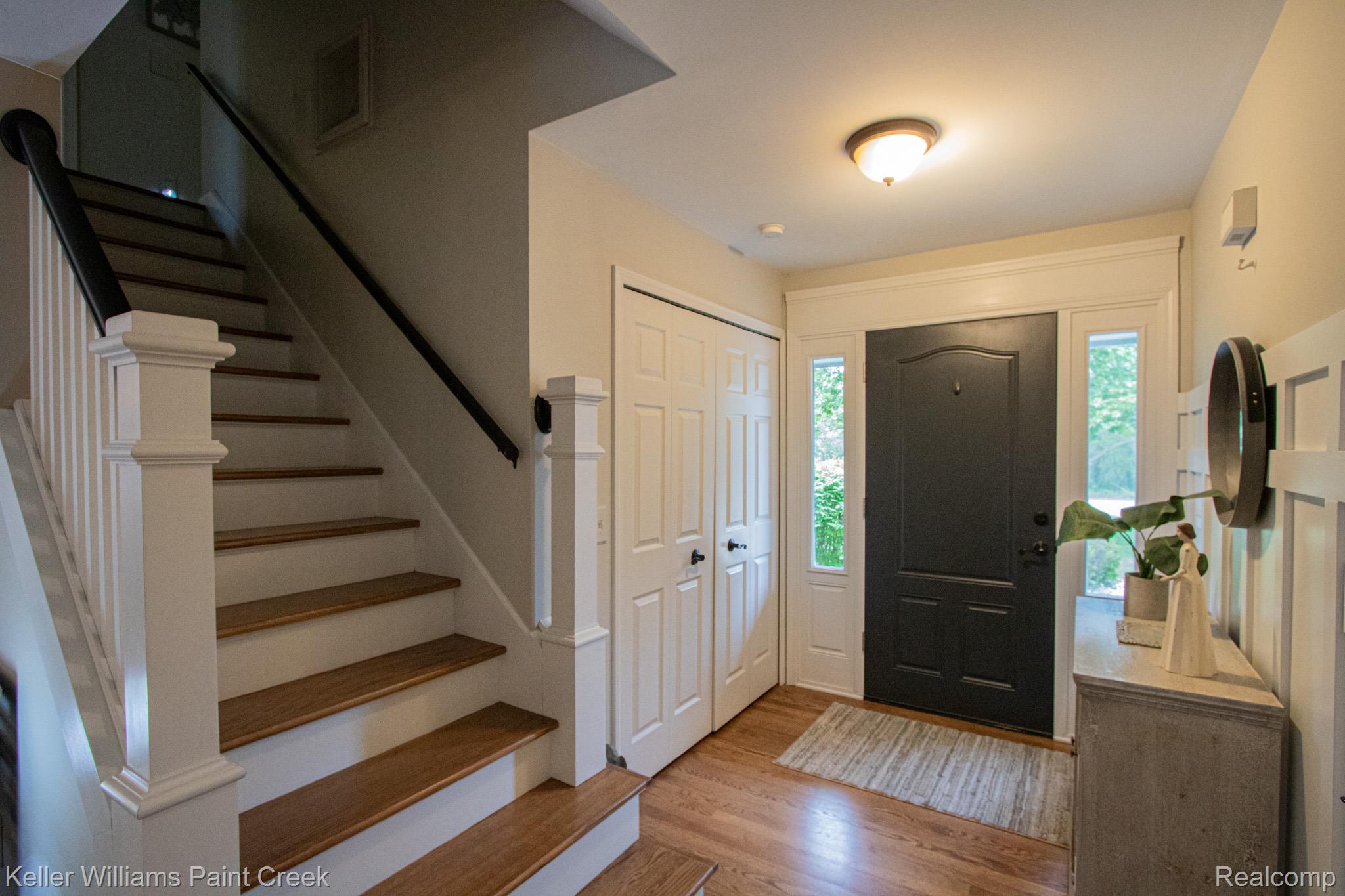 70696 Mellen Street Romeo, MI 48065 - Photo 4 of 46 Entrance foyer with stairs and light wood finished floors