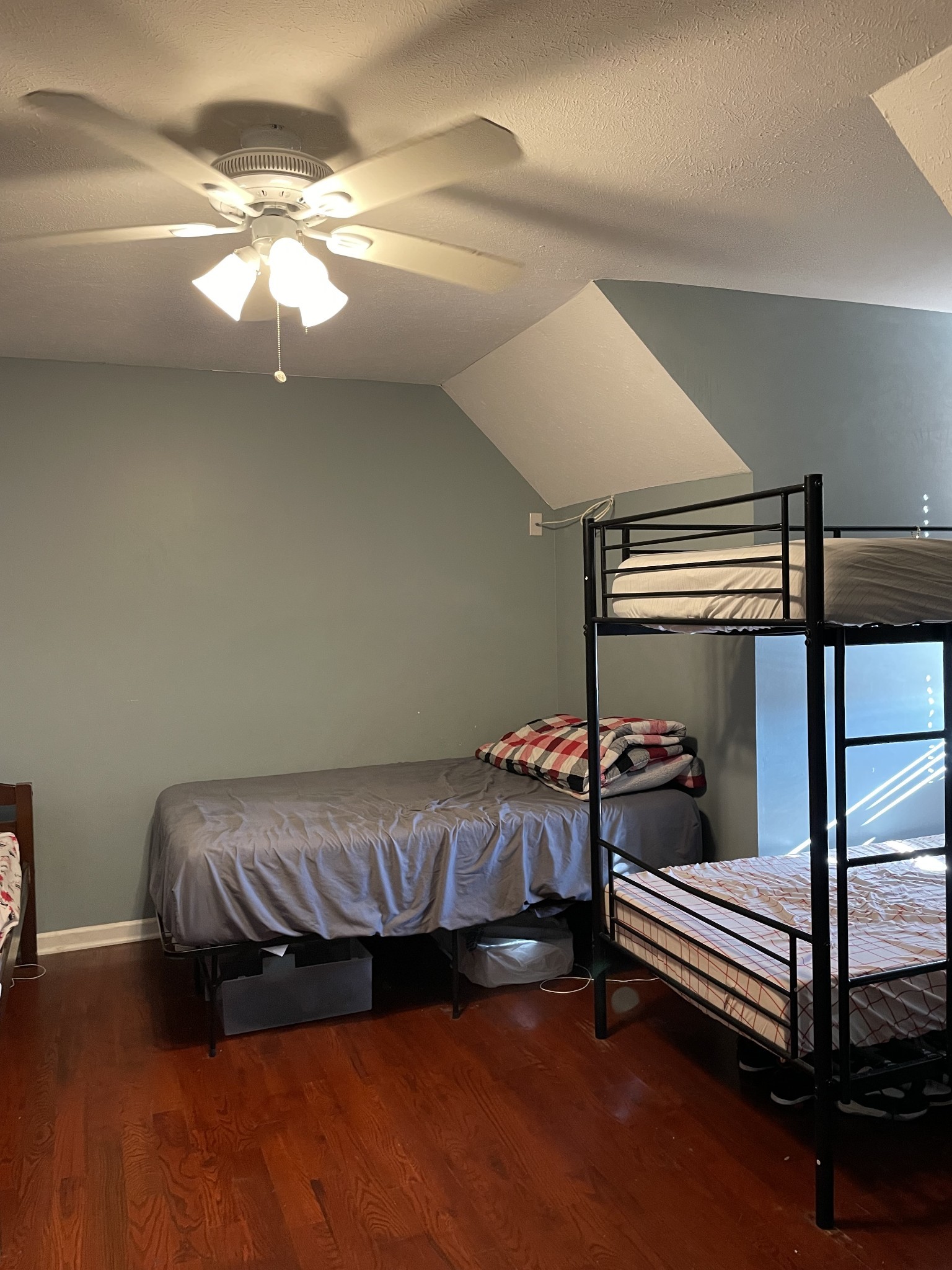 552 Piccadilly Row Antioch, TN 37013 - Photo 17 of 36 a bedroom with a bed and wooden floor