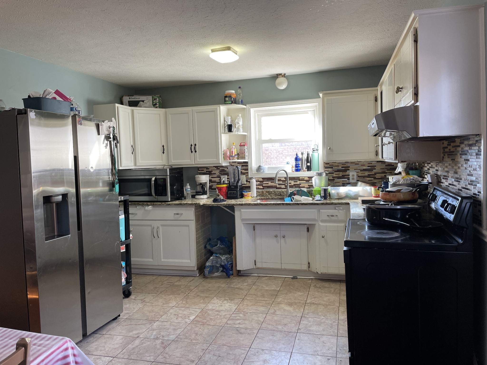 552 Piccadilly Row Antioch, TN 37013 - Photo 9 of 36 a kitchen with stainless steel appliances a refrigerator sink stove and cabinets