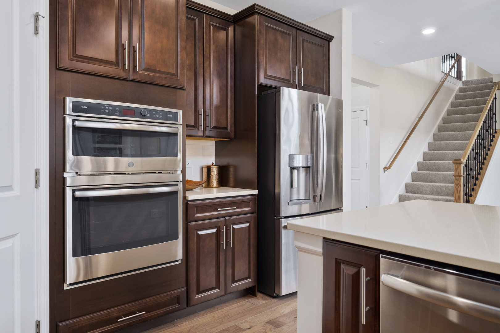 3648 Edelweiss Road Elgin, IL 60124 - Photo 17 of 32 a kitchen with granite countertop a refrigerator stove and cabinets