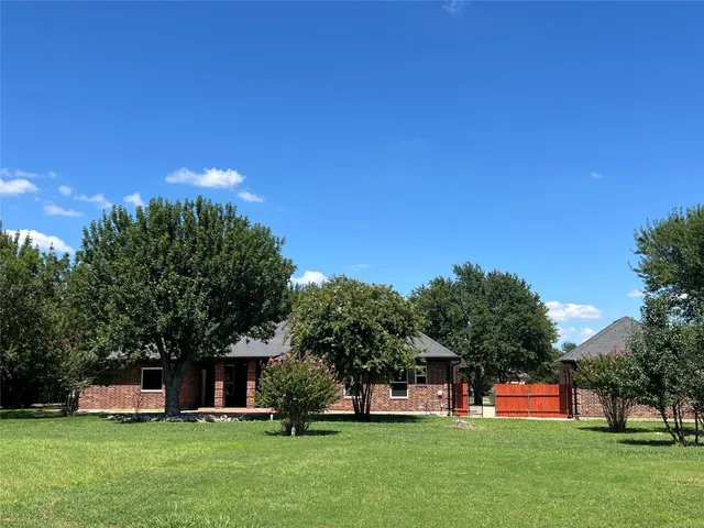 a view of a house with a big yard