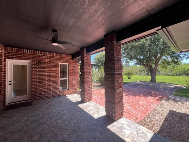 a view of a porch with wooden floor