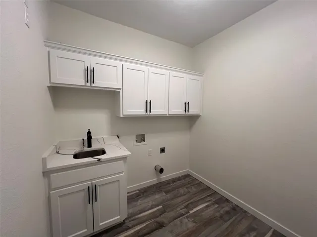 a kitchen with a sink and cabinets