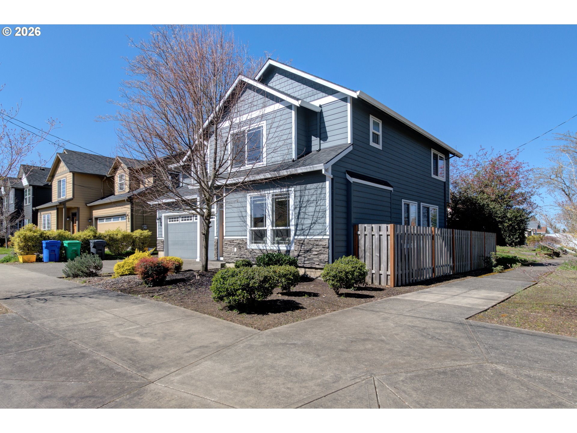7473 Northeast Fremont Street Portland, OR 97213 - Photo 2 of 41 a front view of a house with lots of green space