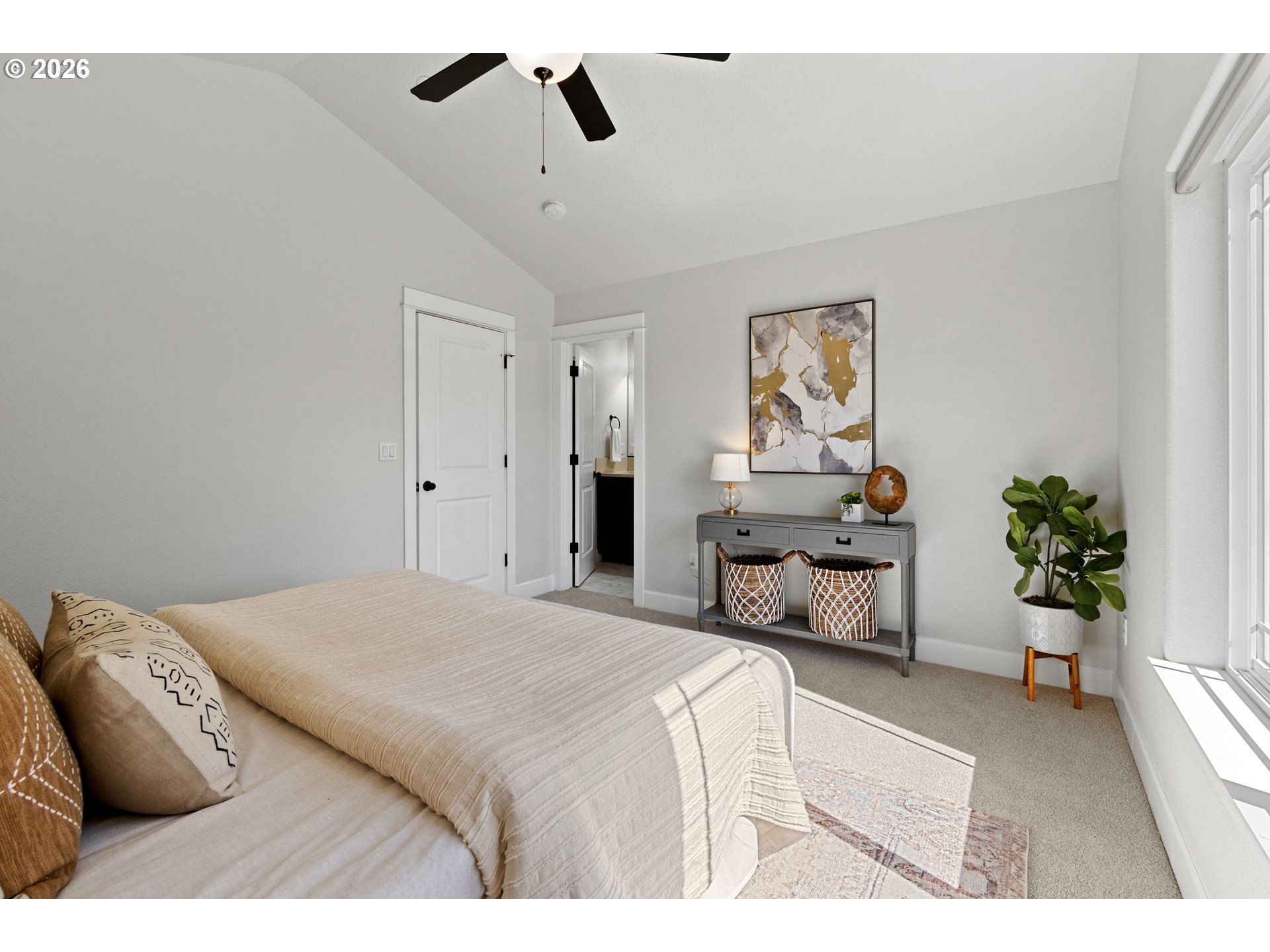 7473 Northeast Fremont Street Portland, OR 97213 - Photo 21 of 41 a bedroom with a bed a couch and potted plant