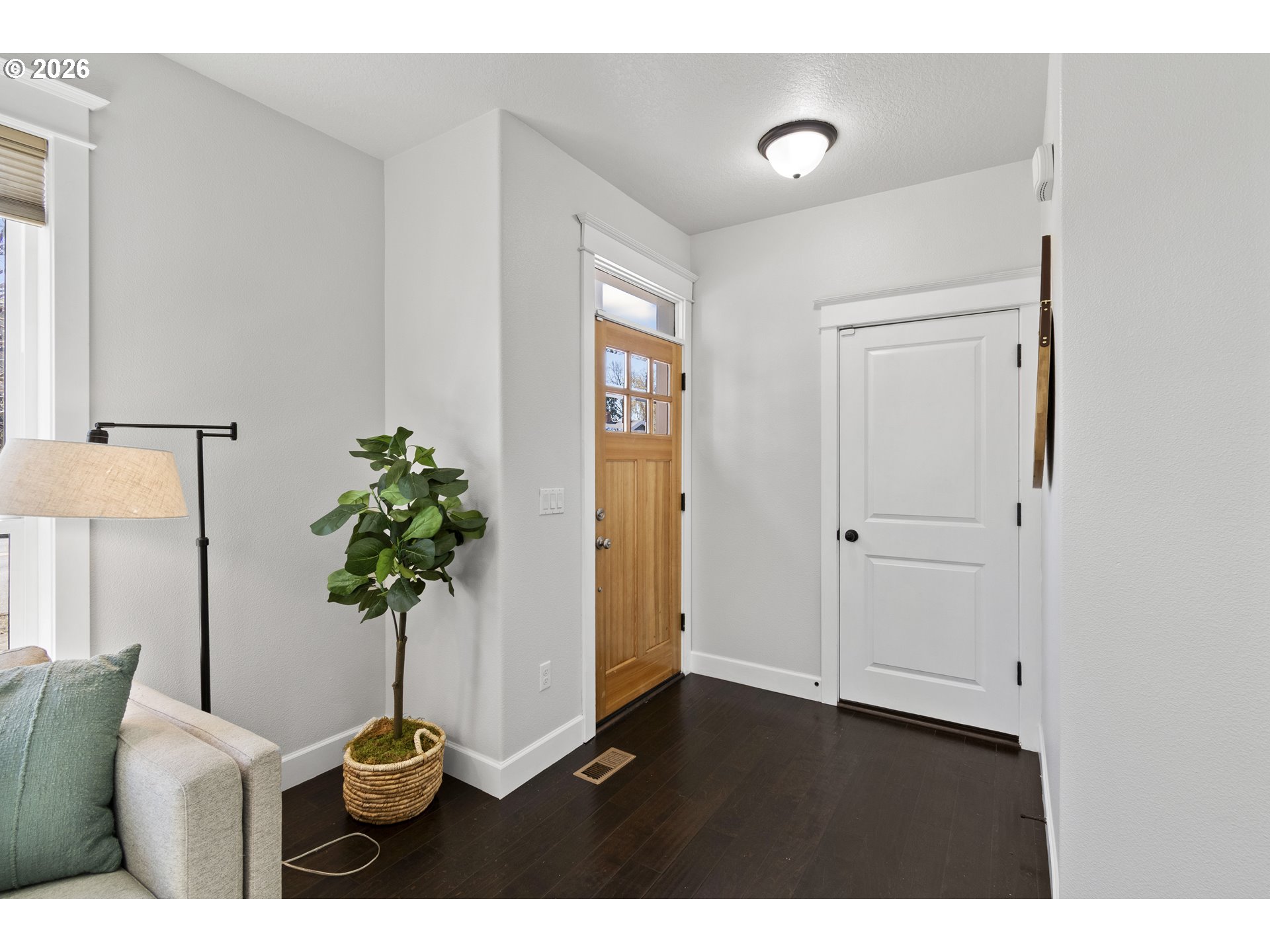 7473 Northeast Fremont Street Portland, OR 97213 - Photo 3 of 41 a living room with furniture and a potted plant