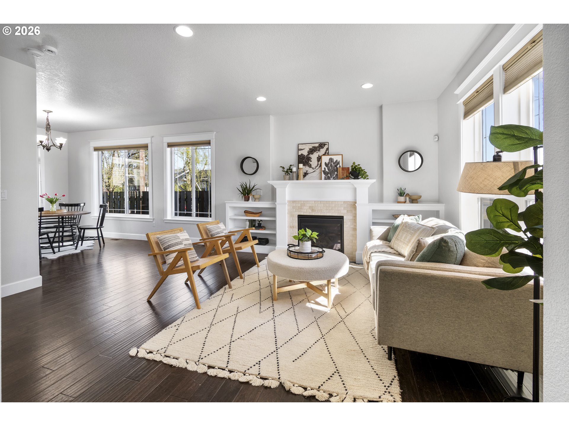 7473 Northeast Fremont Street Portland, OR 97213 - Photo 4 of 41 a living room with furniture a table and a fireplace