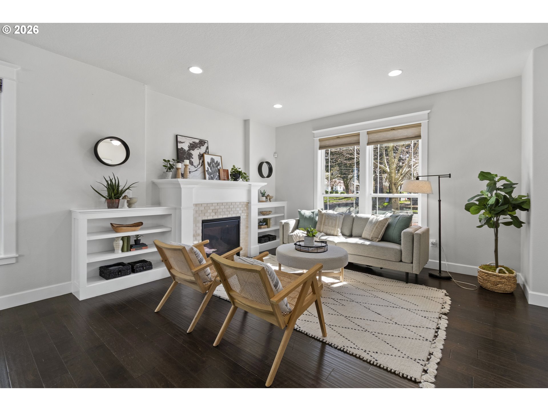 7473 Northeast Fremont Street Portland, OR 97213 - Photo 5 of 41 a living room with furniture a fireplace and a large window
