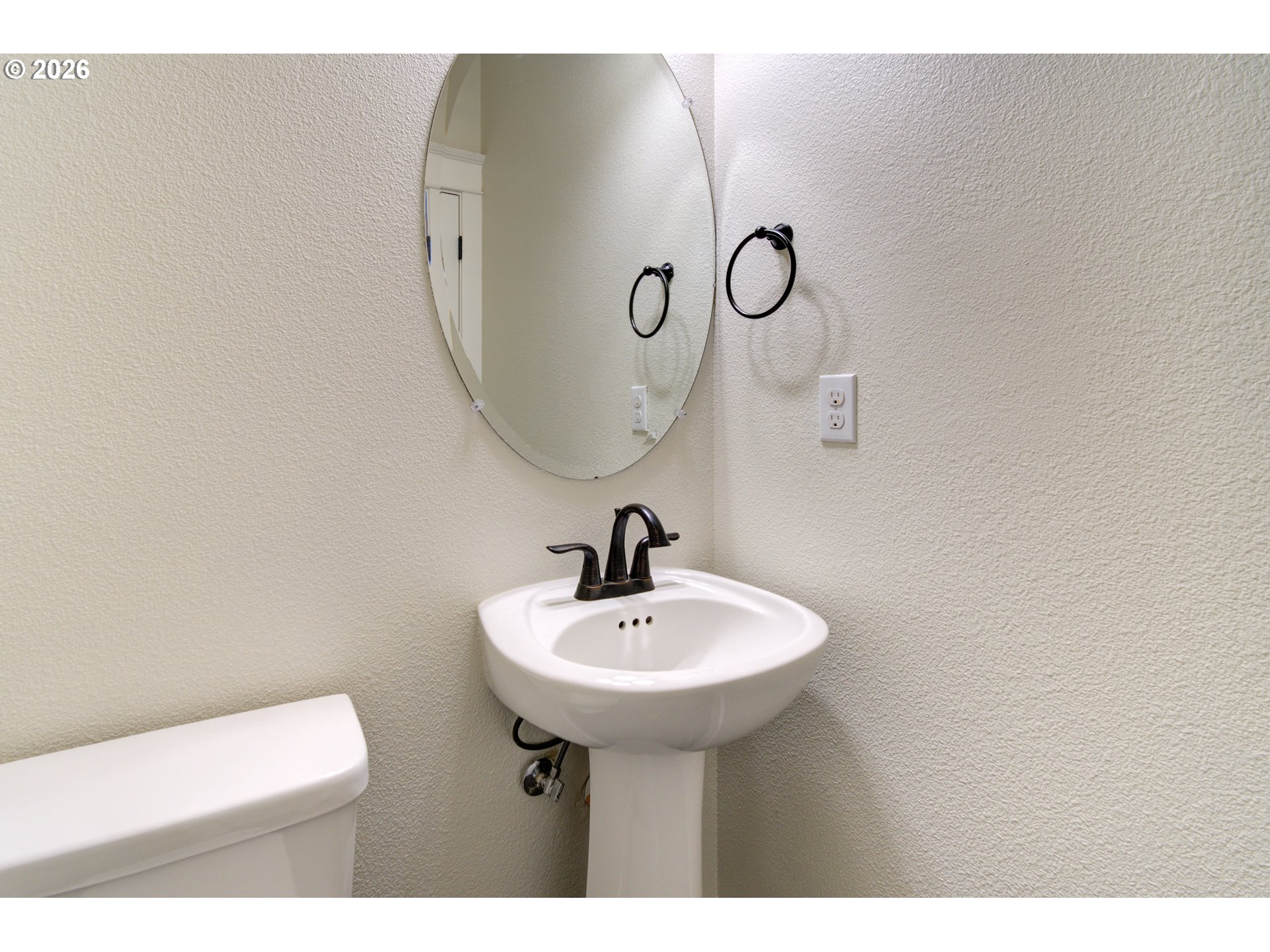 7473 Northeast Fremont Street Portland, OR 97213 - Photo 9 of 41 a bathroom with a sink a mirror and shower