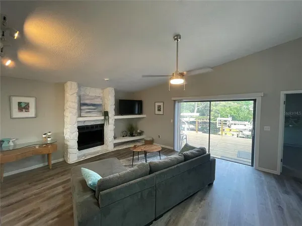 a living room with furniture window and a fireplace