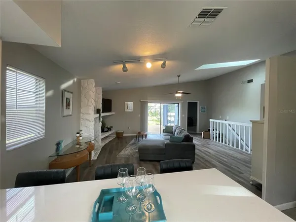 a living room with furniture and a lamp