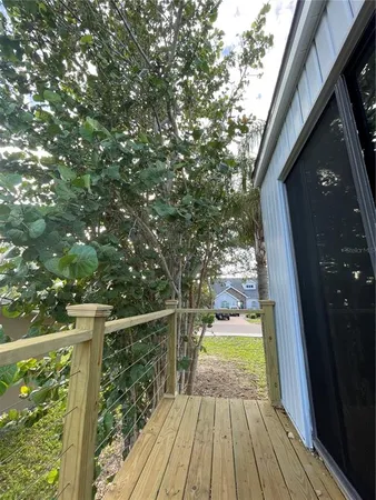 a view of balcony with wooden floor