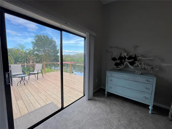 a room with a bed and a large window