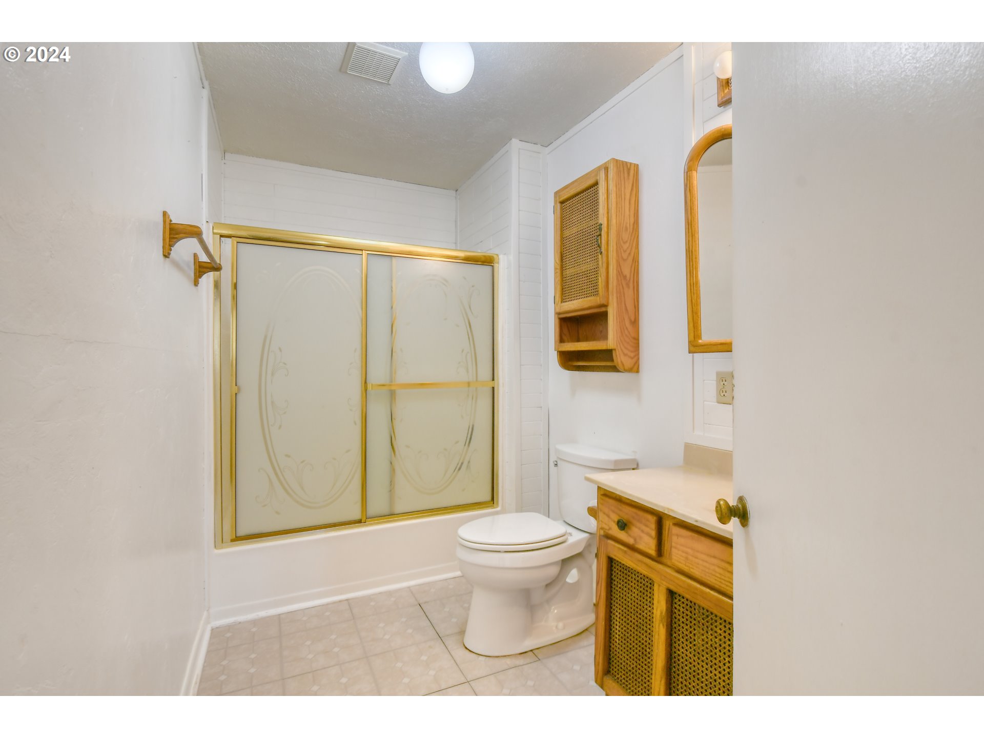 3810 Northeast Riverside Avenue Pendleton, OR 97801 - Photo 16 of 45 a bathroom with a toilet sink and mirror