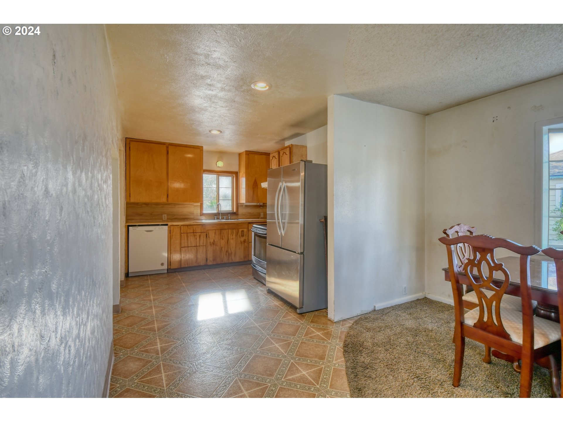 3810 Northeast Riverside Avenue Pendleton, OR 97801 - Photo 23 of 45 a kitchen with stainless steel appliances kitchen island granite countertop furniture and a refrigerator