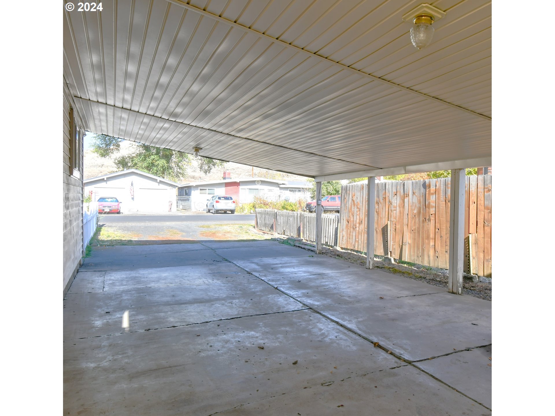 3810 Northeast Riverside Avenue Pendleton, OR 97801 - Photo 4 of 45 a view of a room with wooden floor and iron fence