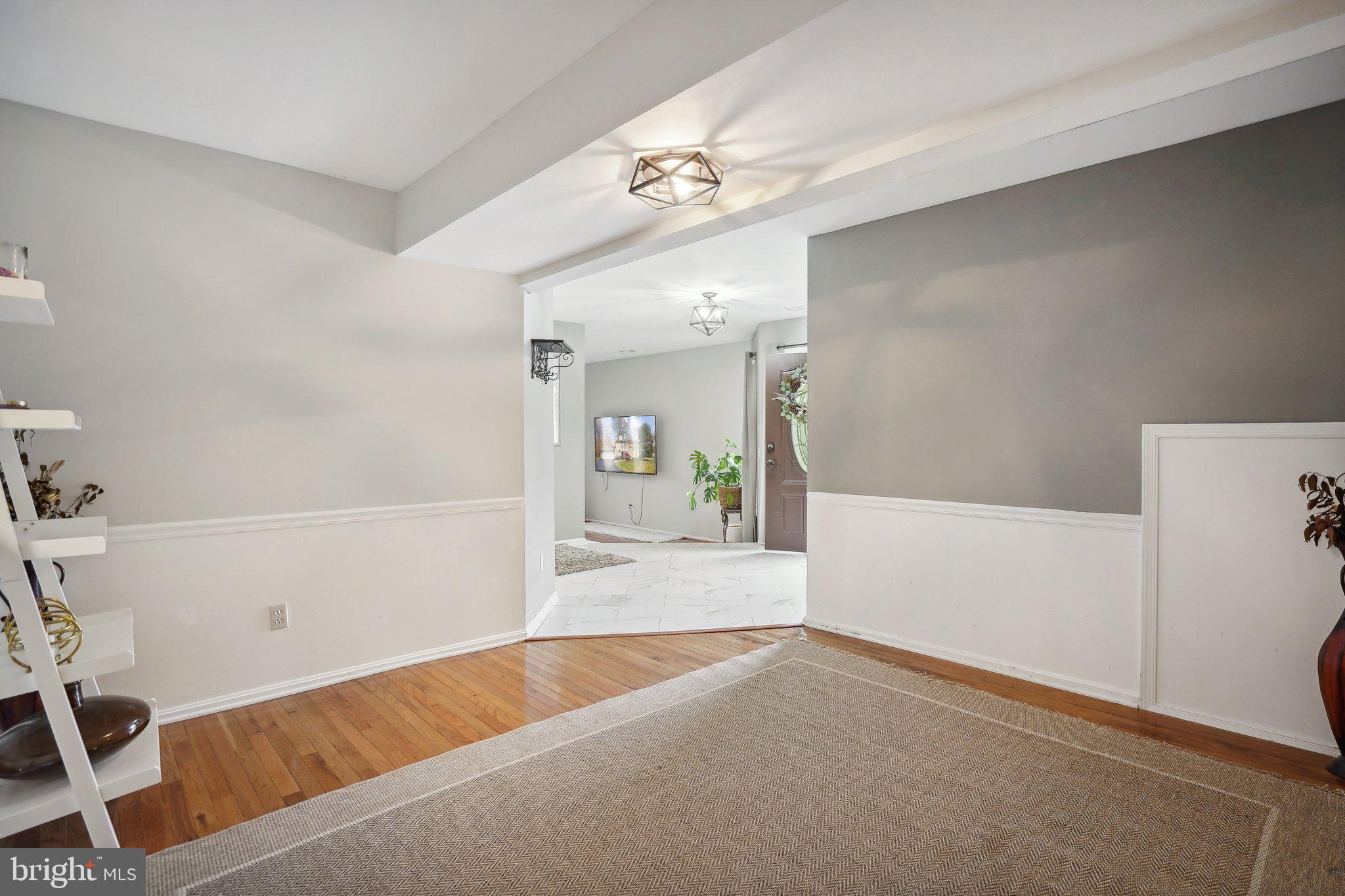 3111 Courtside Road Bowie, MD 20721 - Photo 11 of 41 a view of a room with a window and a wooden floor