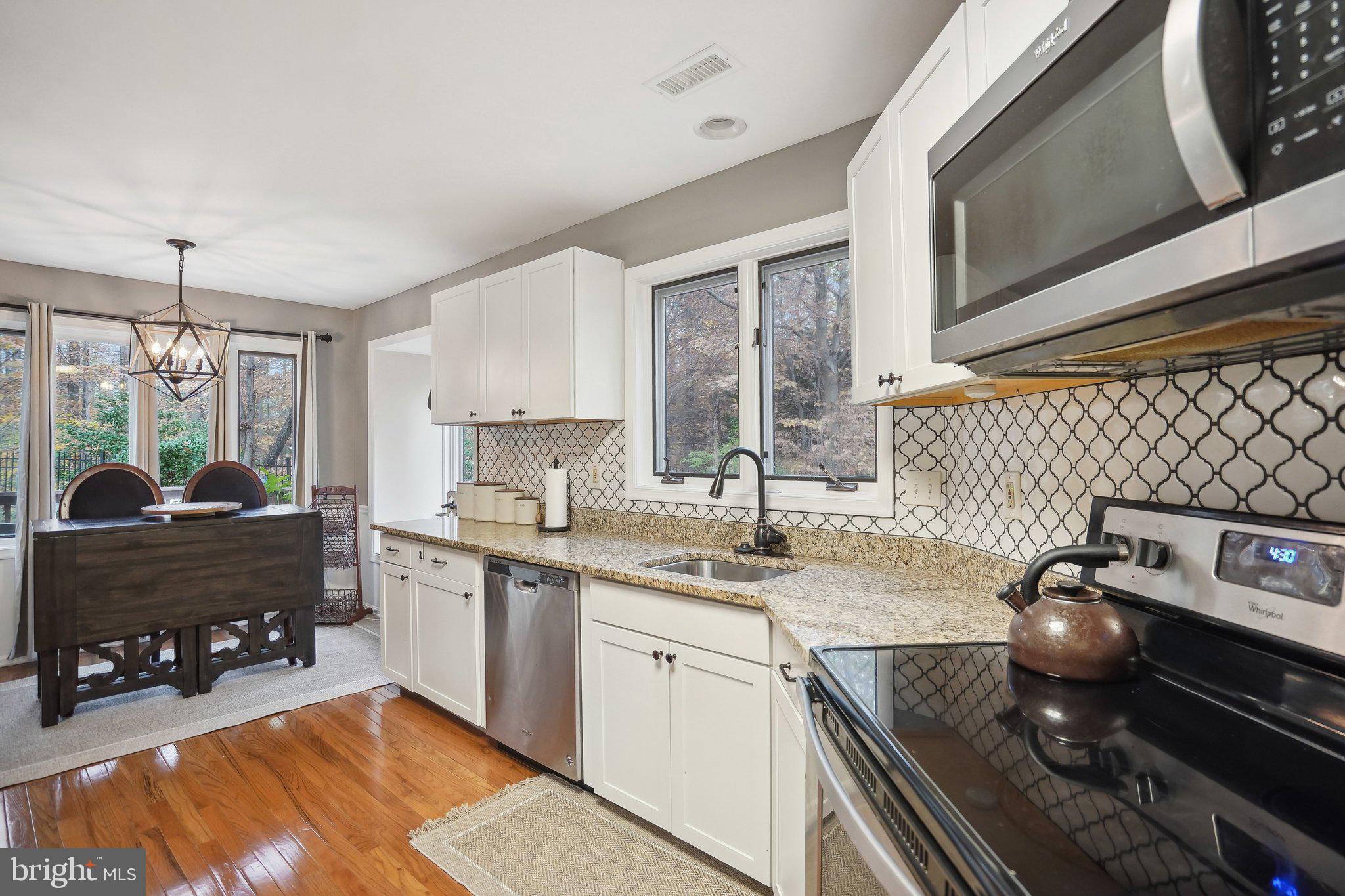 3111 Courtside Road Bowie, MD 20721 - Photo 19 of 41 a kitchen with a sink appliances and cabinets