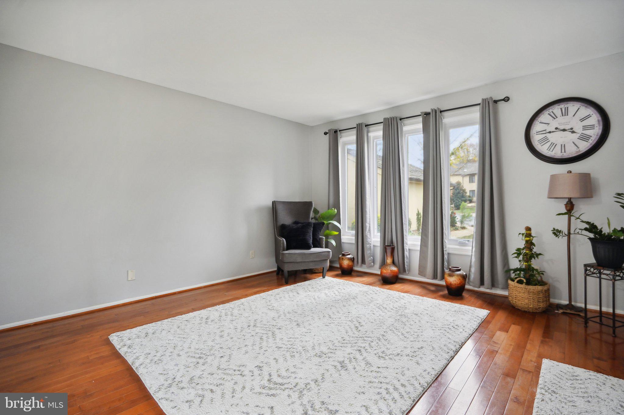 3111 Courtside Road Bowie, MD 20721 - Photo 21 of 41 wooden floor with a large window in a room