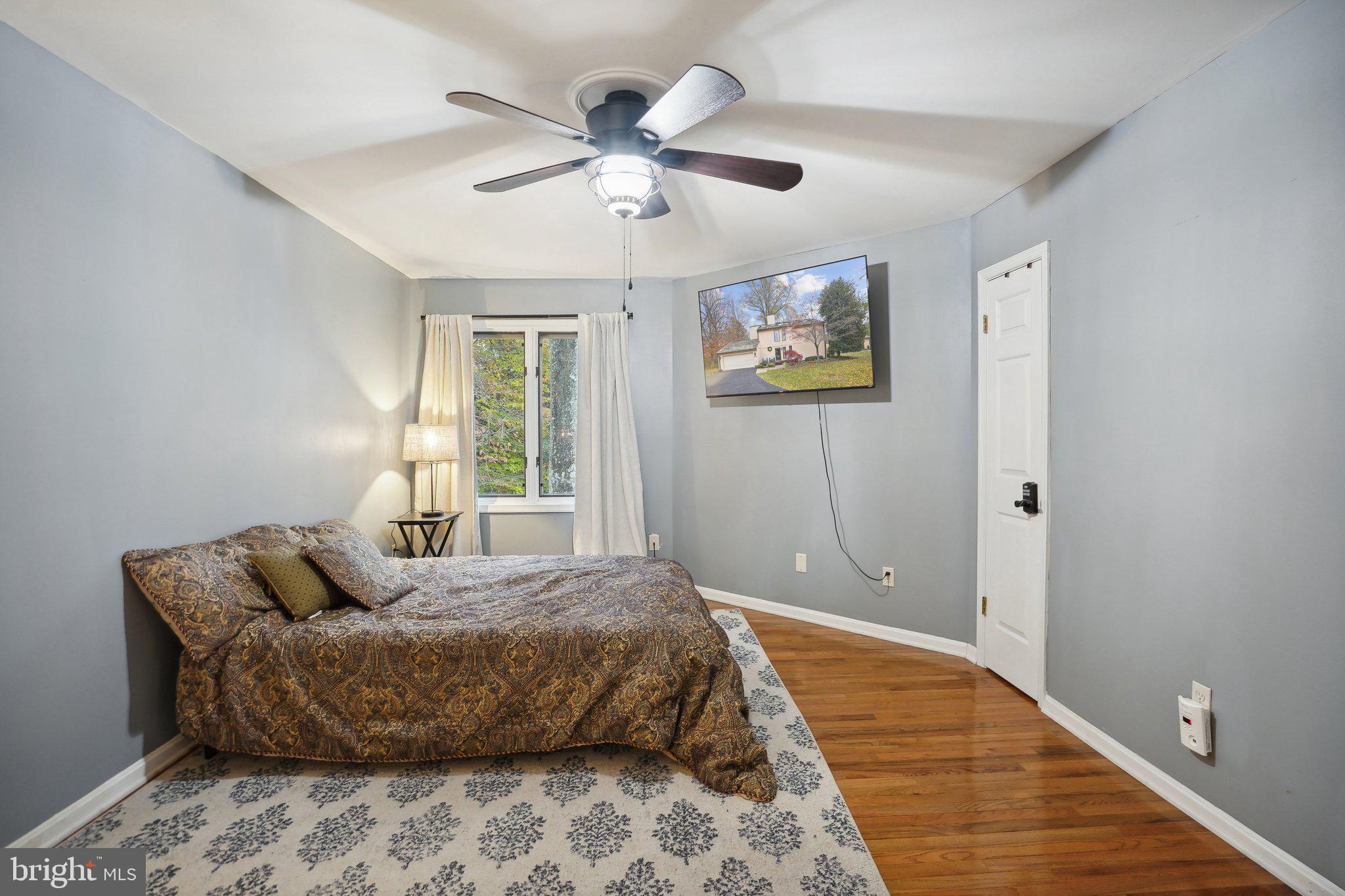 3111 Courtside Road Bowie, MD 20721 - Photo 35 of 41 a bedroom with a large bed and a window