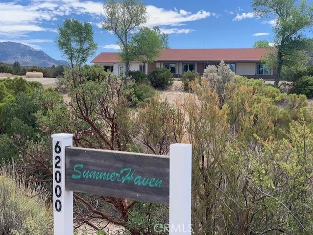 a view of a sign board with yard