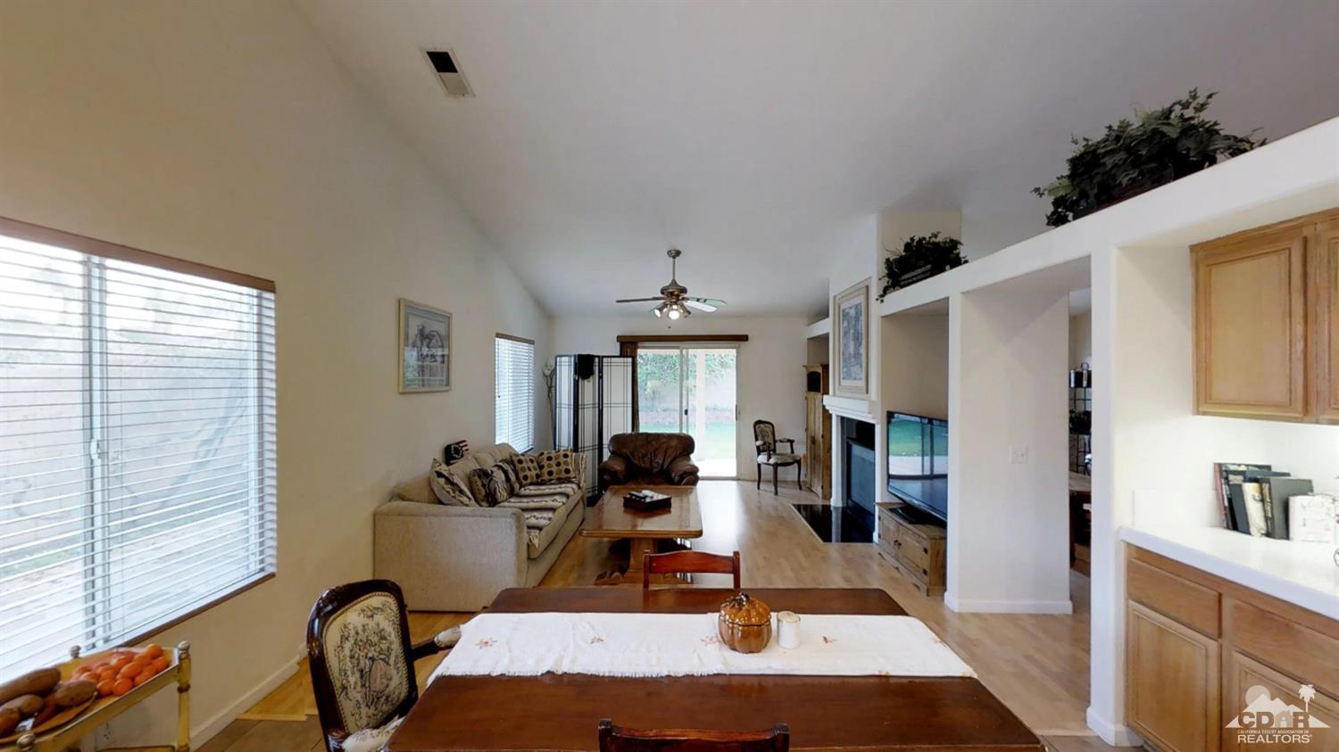 80609 Declaration Avenue Indio, CA 92201 - Photo 3 of 30 a living room with furniture a dining table and a window