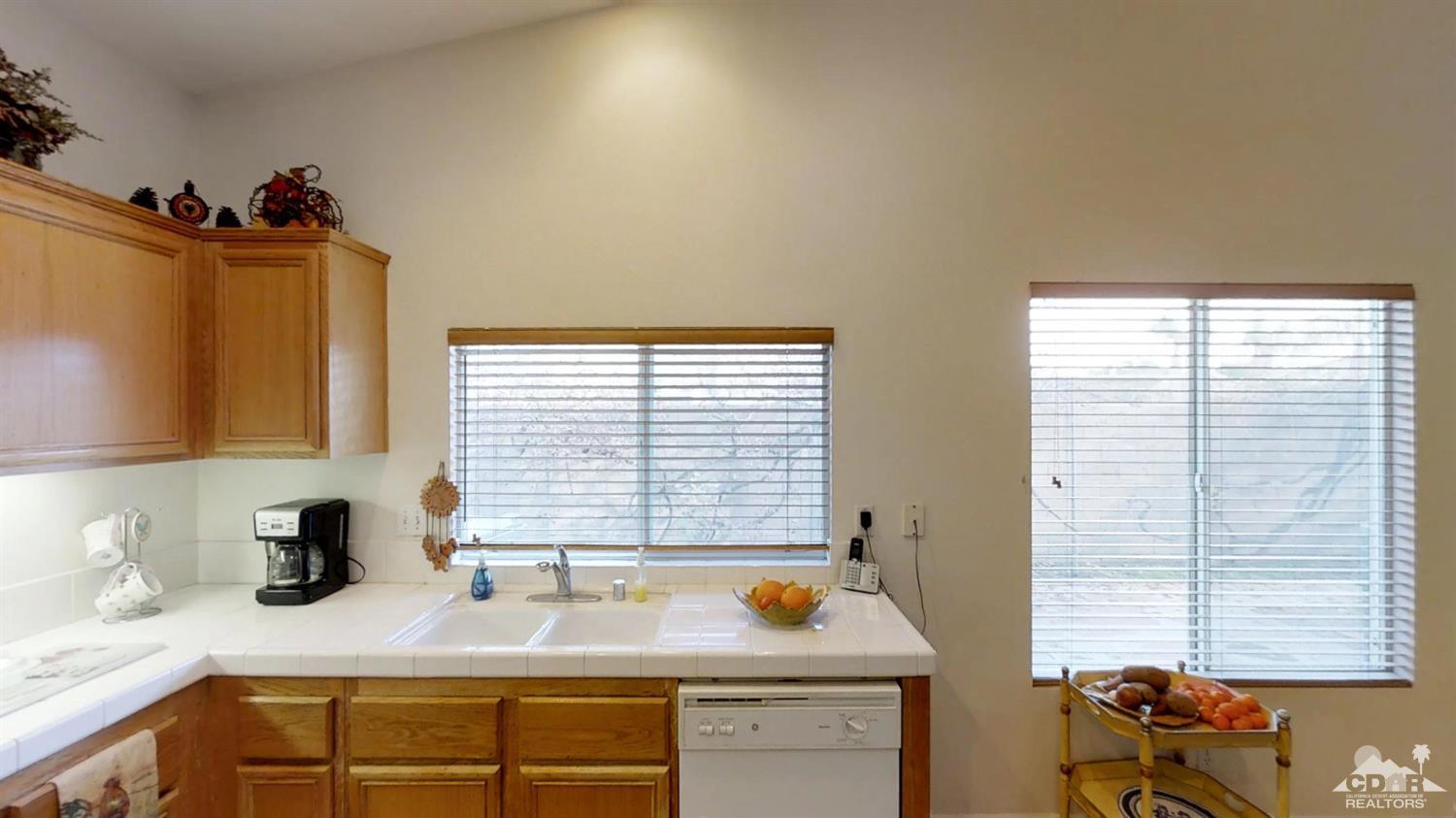 80609 Declaration Avenue Indio, CA 92201 - Photo 5 of 30 a kitchen with a sink and a window