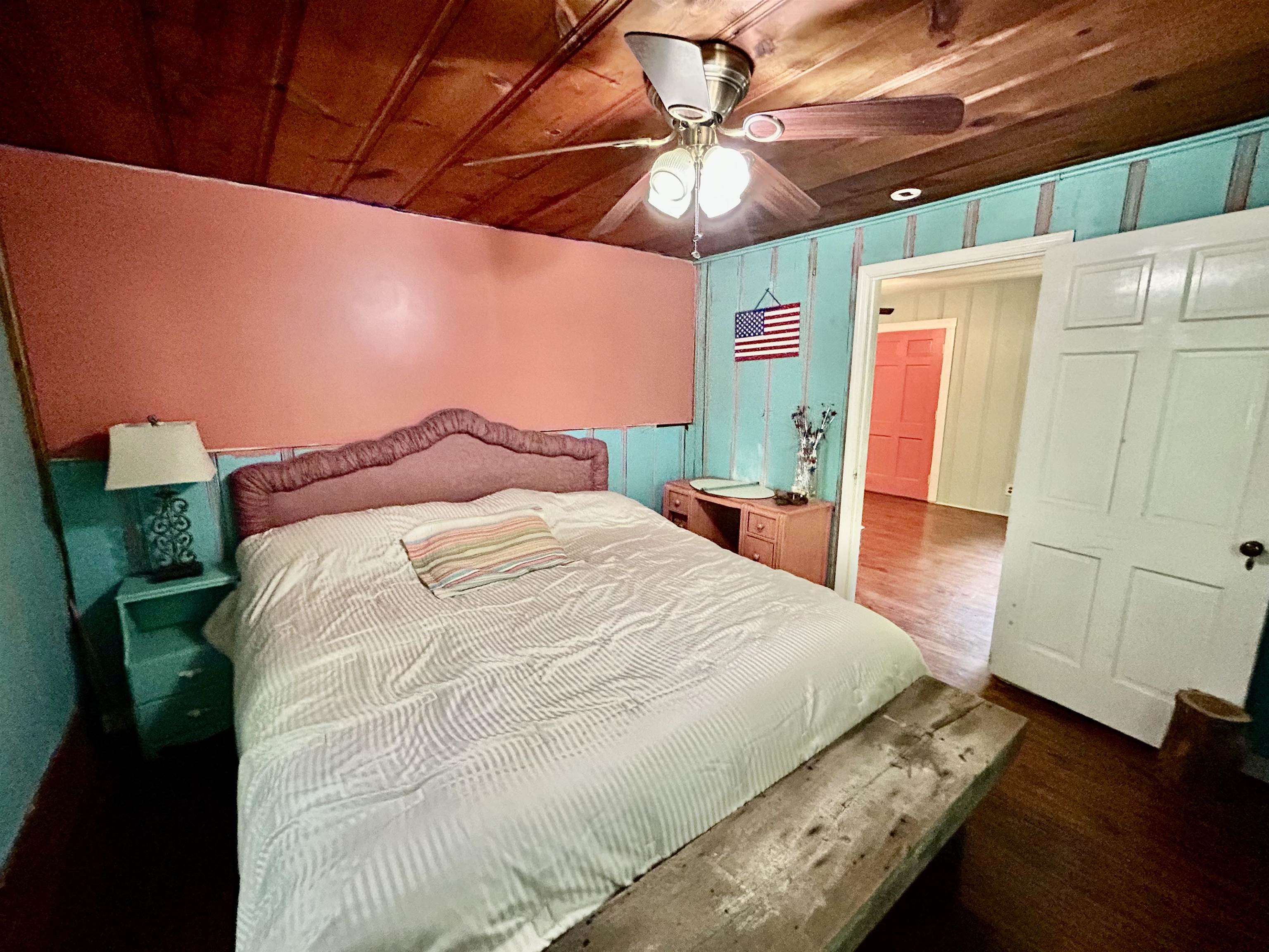 460 Port Lane Counce, TN 38326 - Photo 15 of 23 Bedroom featuring dark wood-type flooring, a ceiling fan, and wood ceiling