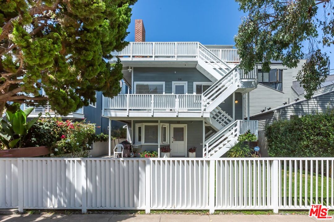 27 Buccaneer Street Marina del Rey, CA 90292 - Photo 1 of 15 a view of a house with a wooden fence