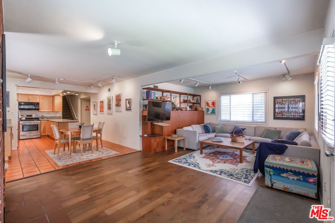 27 Buccaneer Street Marina del Rey, CA 90292 - Photo 11 of 15 a living room with furniture and a wooden floor