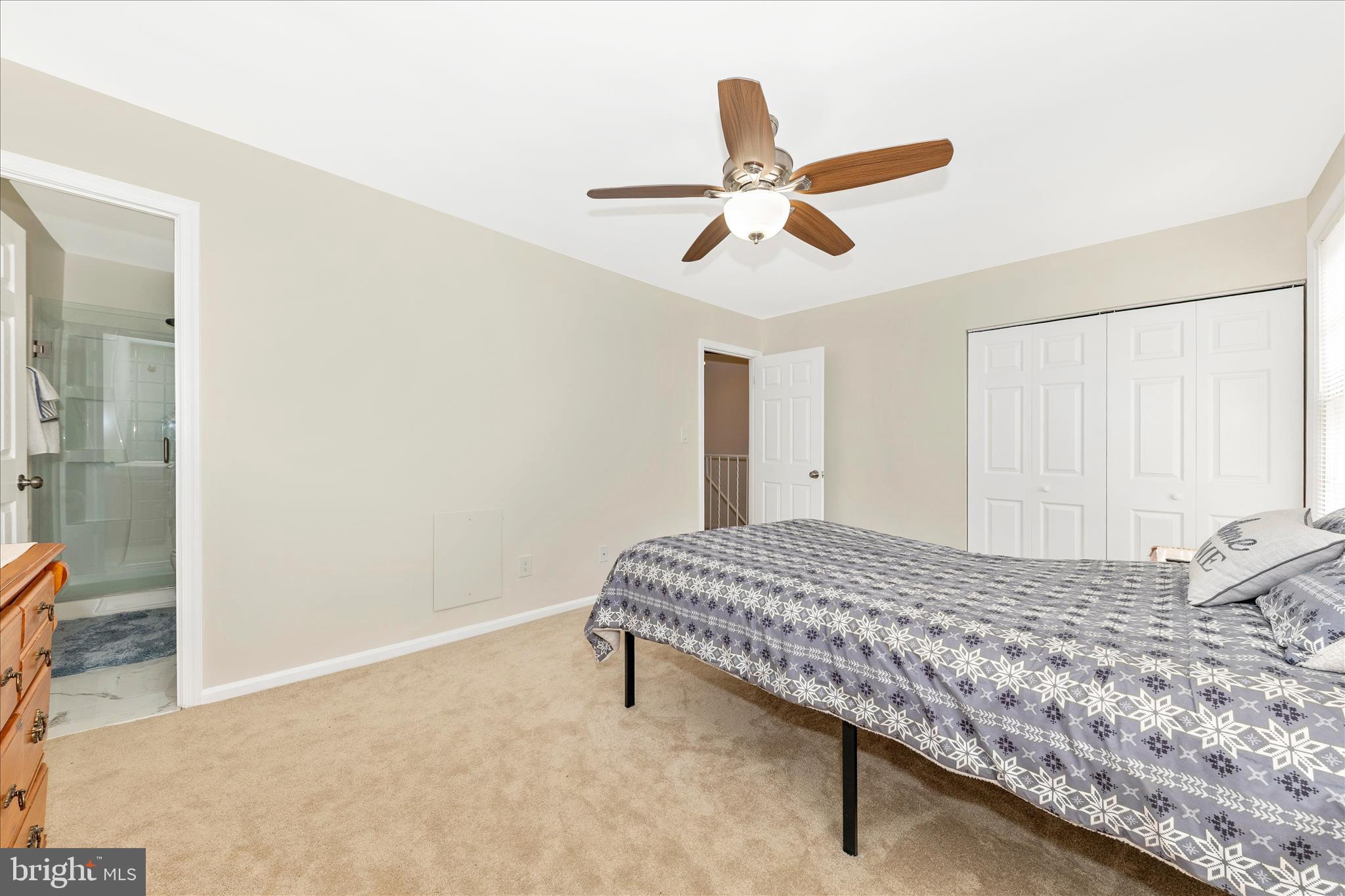 9923 Maple Leaf Drive Gaithersburg, MD 20886 - Photo 18 of 38 a bedroom with a bed and a chandelier