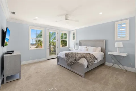 a spacious bedroom with a large bed and a window