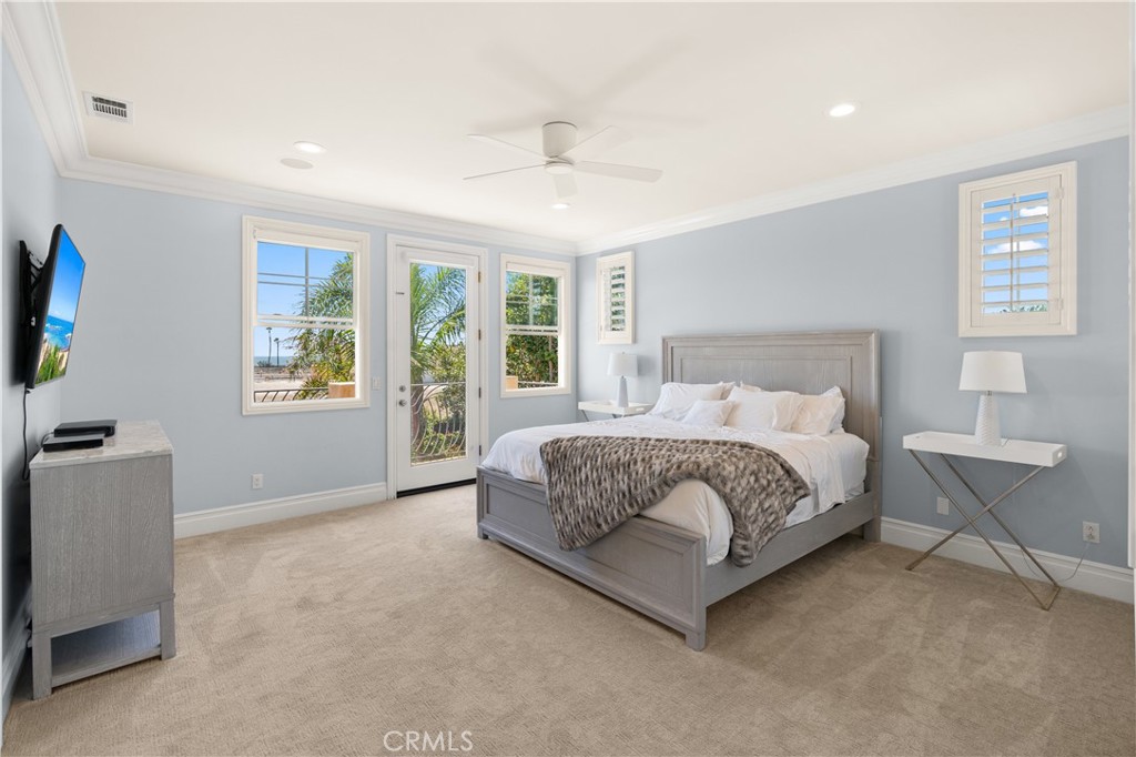 6572 Beachview Drive Huntington Beach, CA 92648 - Photo 9 of 17 a spacious bedroom with a large bed and a window