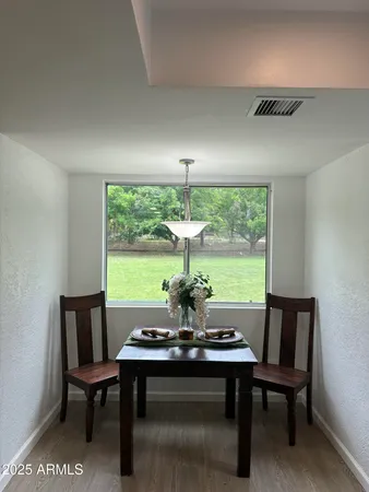 a view of a dining room with furniture window and outside view