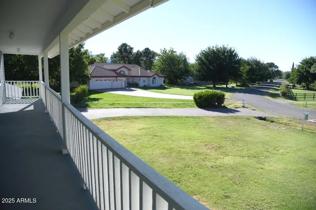 a view of swimming pool from a balcony