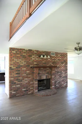 a view of an empty room and fire place