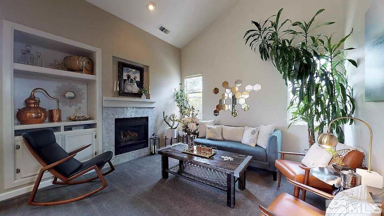 10290 Wolf Ridge Way Reno, NV 89521 - Photo 11 of 22 a living room with furniture and a fireplace