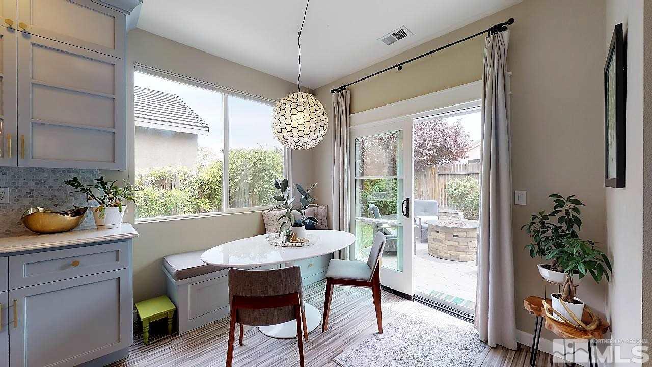10290 Wolf Ridge Way Reno, NV 89521 - Photo 12 of 22 a view of a dining room with furniture window and outside view
