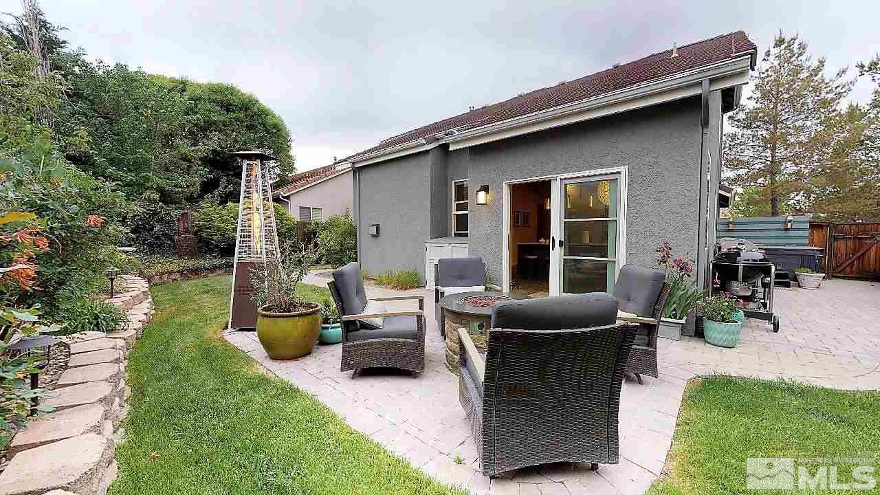 10290 Wolf Ridge Way Reno, NV 89521 - Photo 15 of 22 a view of a patio with couches table and chairs and potted plants