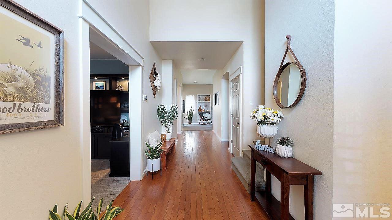 10290 Wolf Ridge Way Reno, NV 89521 - Photo 3 of 22 a view of entryway with wooden floor